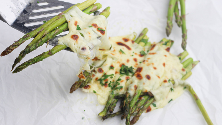 Forkful of cheesy asparagus