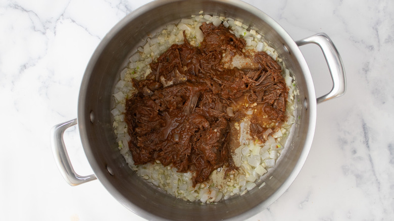 pulled beef cooking with alliums