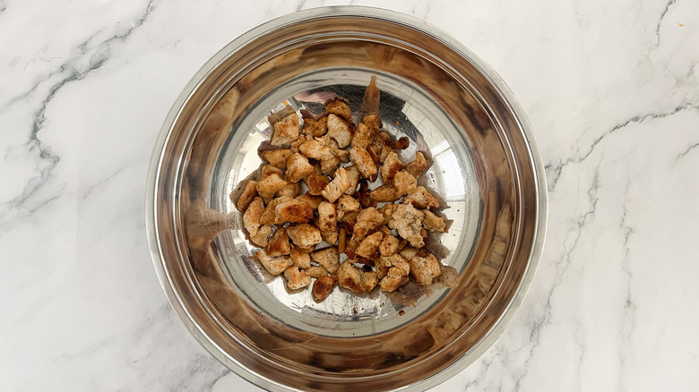 cooked chicken in metal bowl