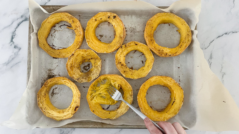 hand shredding spaghetti squash