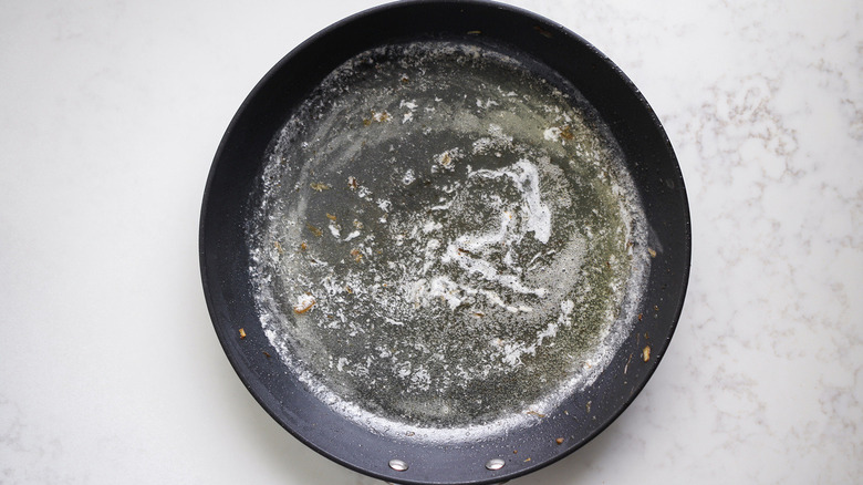 butter in black frying pan