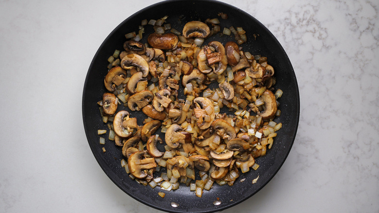 mushrooms and onions in pan