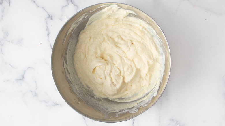 creamy white mixture in a metal bowl