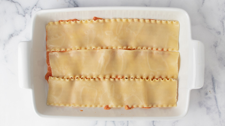 lasagna noodles in a white baking pan