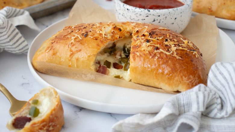 cheesy bacon calzone cut open