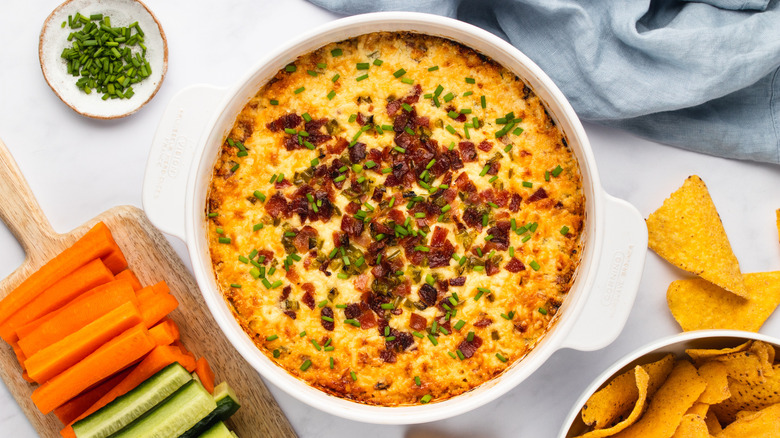 Cheesy bacon jalapeño dip with crudites and tortilla chips