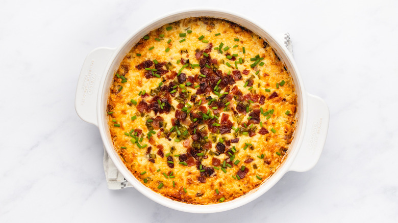 Cheesy bacon jalapeño dip with chive garnish