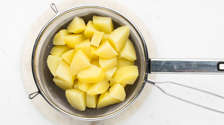 boiled potatoes in strainer