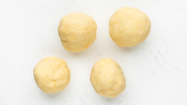 four balls of gnocchi dough