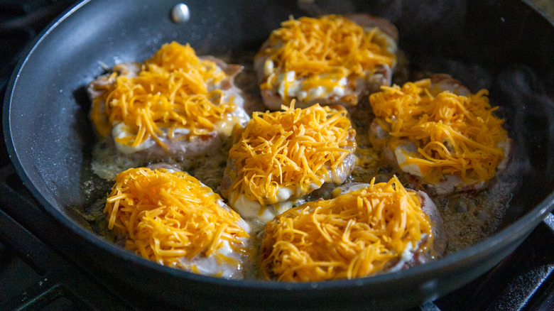 pork chops with shredded cheese