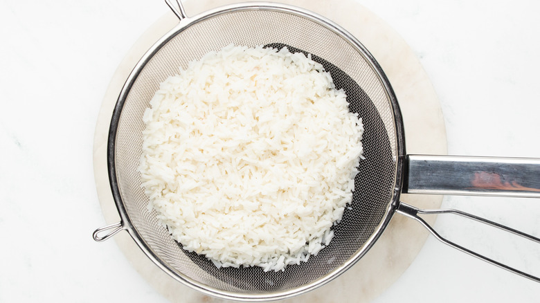 cooked rice in strainer