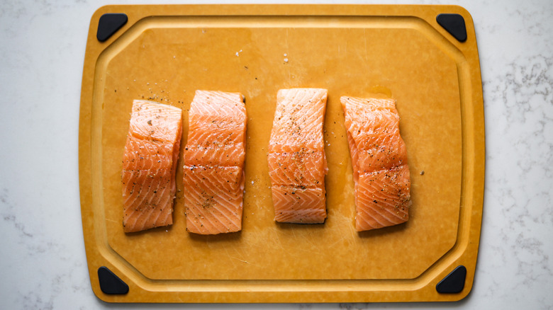 seasoned salmon fillets on board