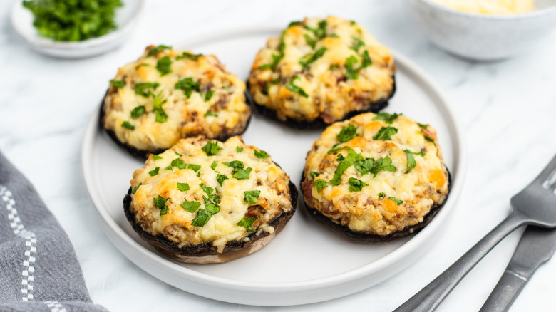 cheesy stuffed mushrooms on plate