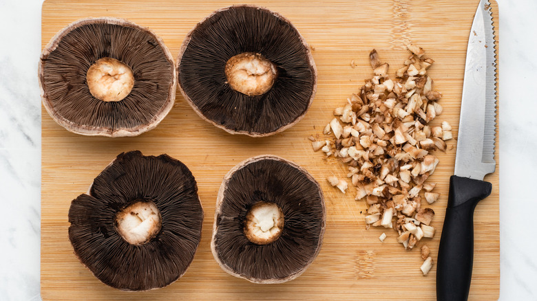 portobello mushrooms on cutting board