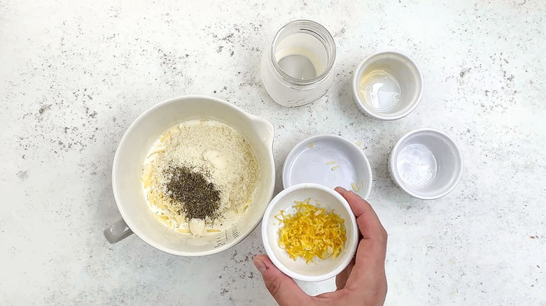 adding lemon zest to cream mixture