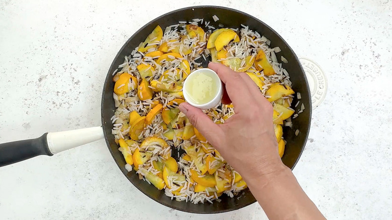 seasoning rice and squash mixture