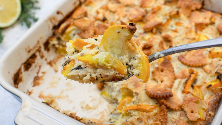 cheesy summer squash casserole with spoon