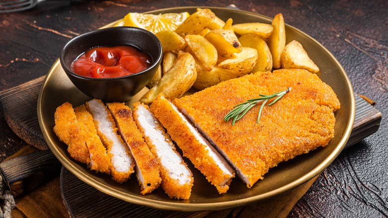 Plate of baked chicken and potatoes