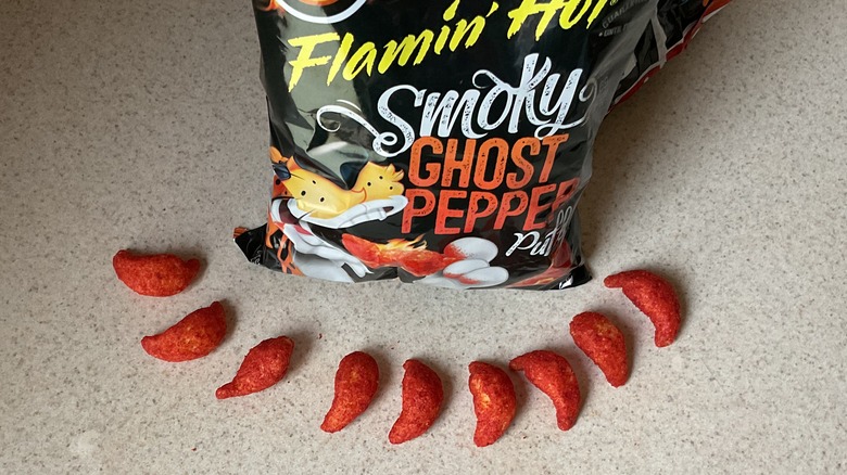 Cheetos shaped like peppers in row