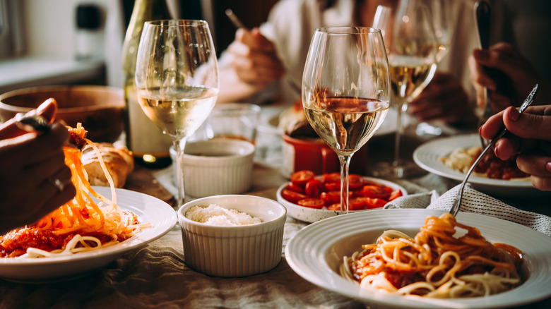 table with pasta and wine