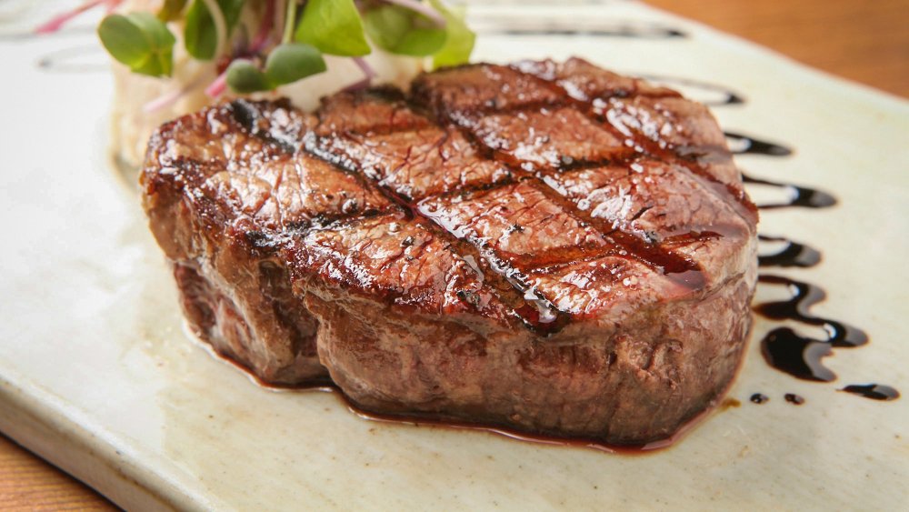 Steak resting on plate