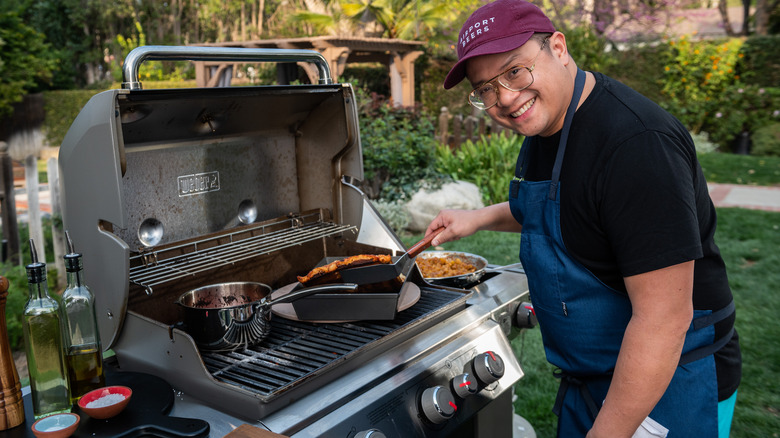 Dale Talde cooking on a grill