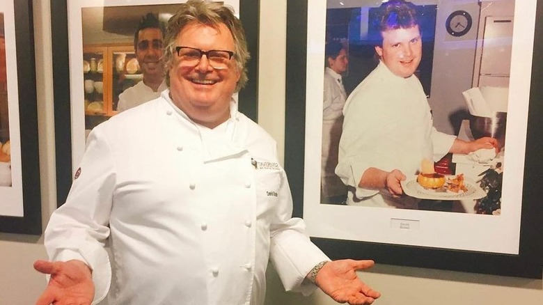 David Burke with a photo of his younger self