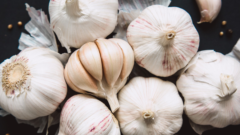 Several garlic bulbs grouped together