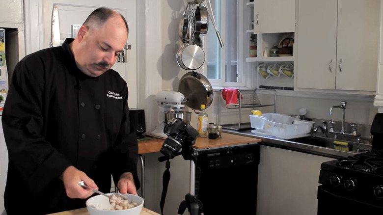 Chef John cooking and filming