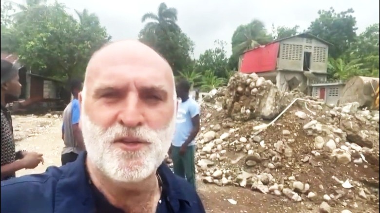 José Andrés speaking near rubble in Haiti