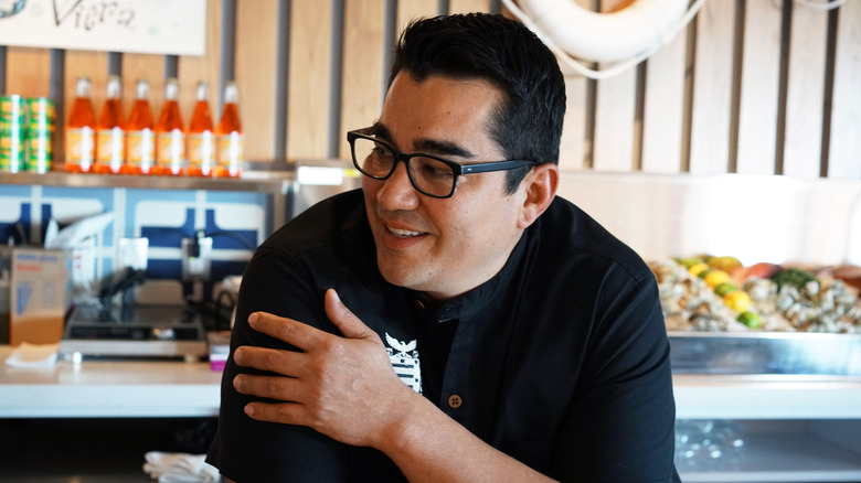 Jose Garces leaning on the counter