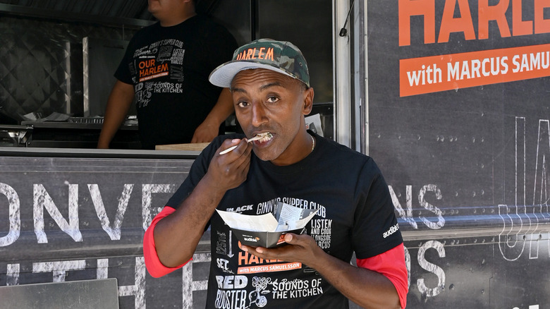 chef marcus samuelsson eat food in front of food truck