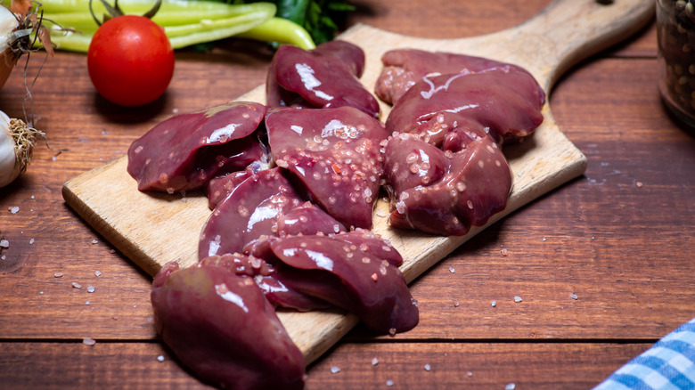 Uncooked liver on cutting board