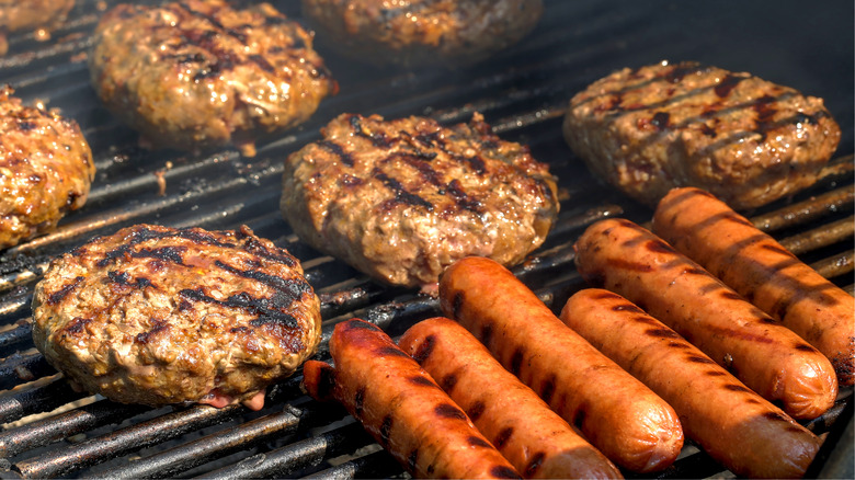 Chef grilling hot dogs and burgers