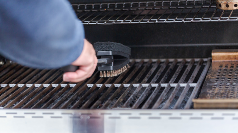 cleaning grill with brush