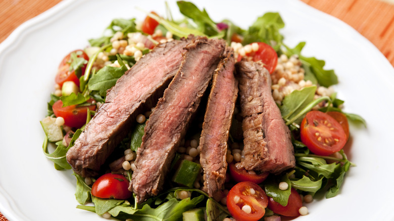 steak salad on white plate