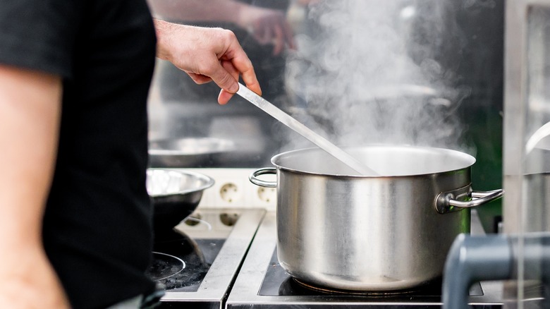 chef making soup