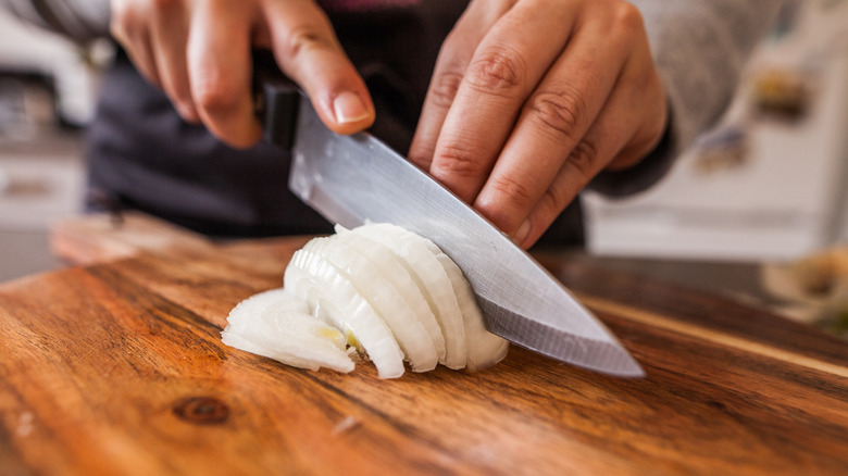 person chopping onions