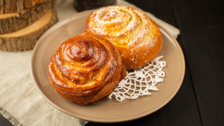 Chelsea buns on brown plate