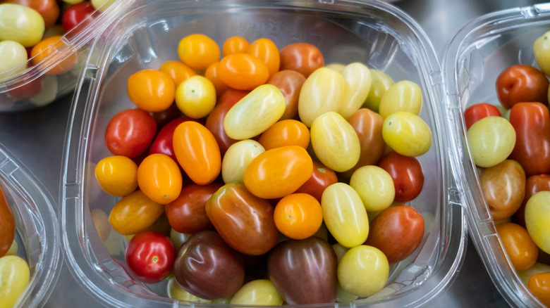 Container of multicolored grape tomatoes