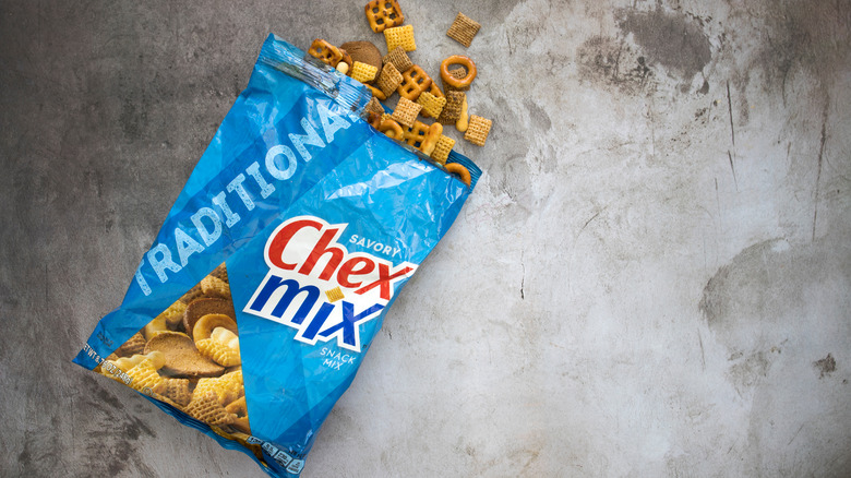 Open Chex Mix bag on marble table