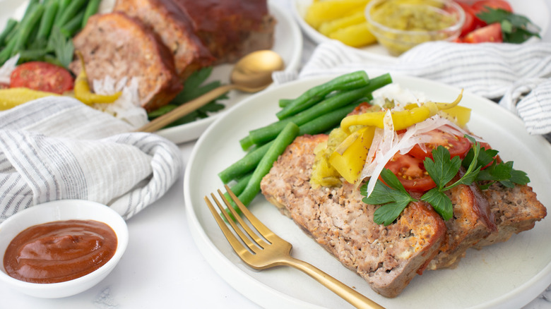 sliced meatloaf with garnishes