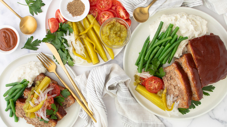 meatloaf with pickles and garnishes