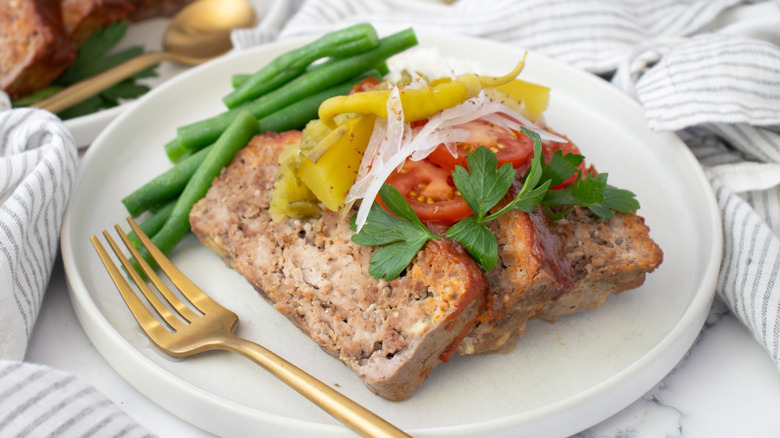 meatloaf with vegetables and garnishes