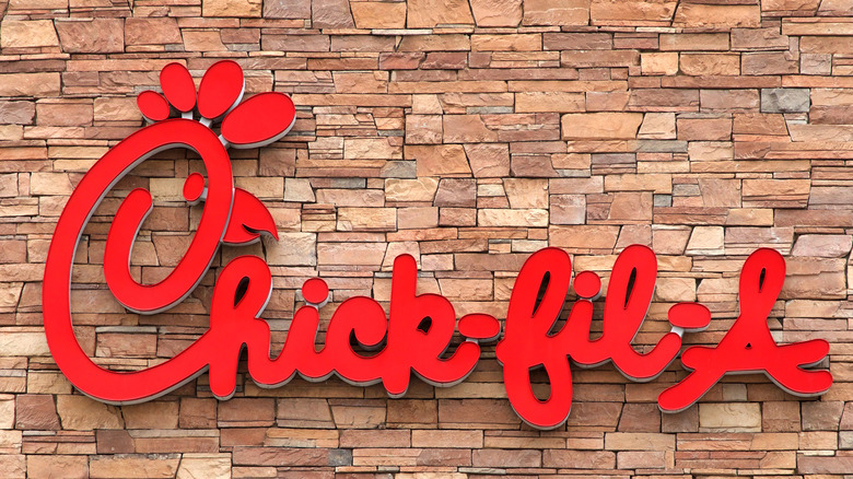 Chick-fil-A logo on brick wall