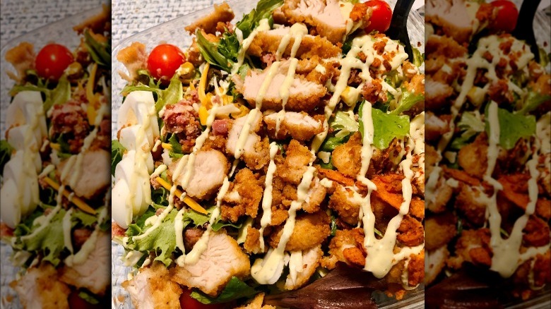 Chick-fil-A cobb salad topped with dressing