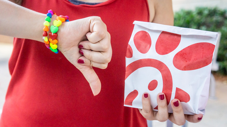 Person giving Chick-fil-A a thumbs-down