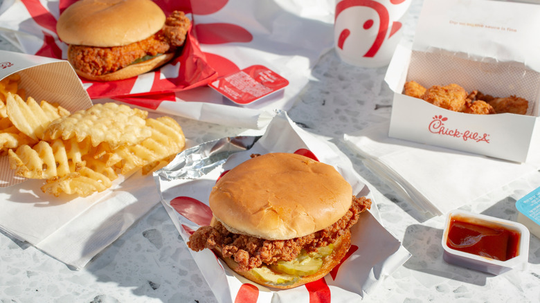 Chick-fil-A sandwiches, fries, and nuggets on food wrappers