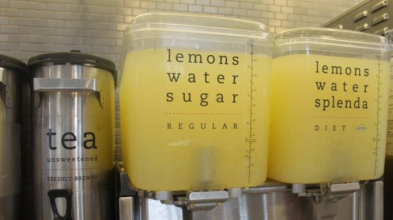 chick-fil-a lemonade dispensers next to tea urn