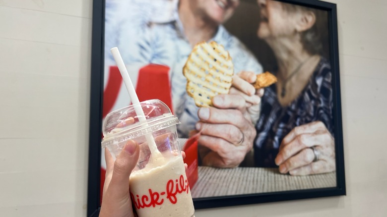 Chick-fil-a drink with poster behind